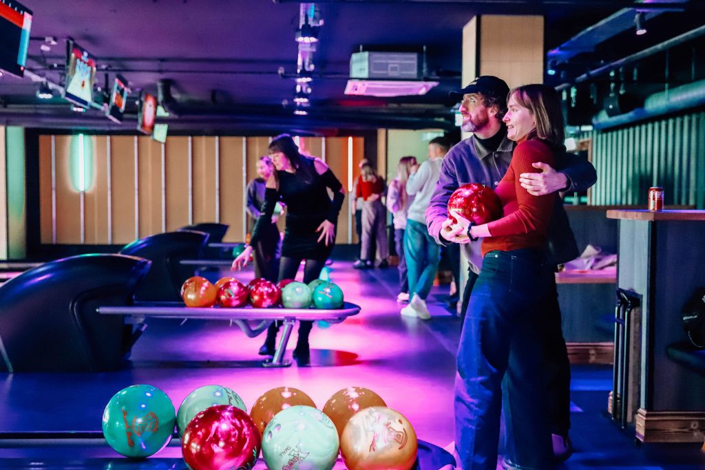 A couple bowling at King Pins.
